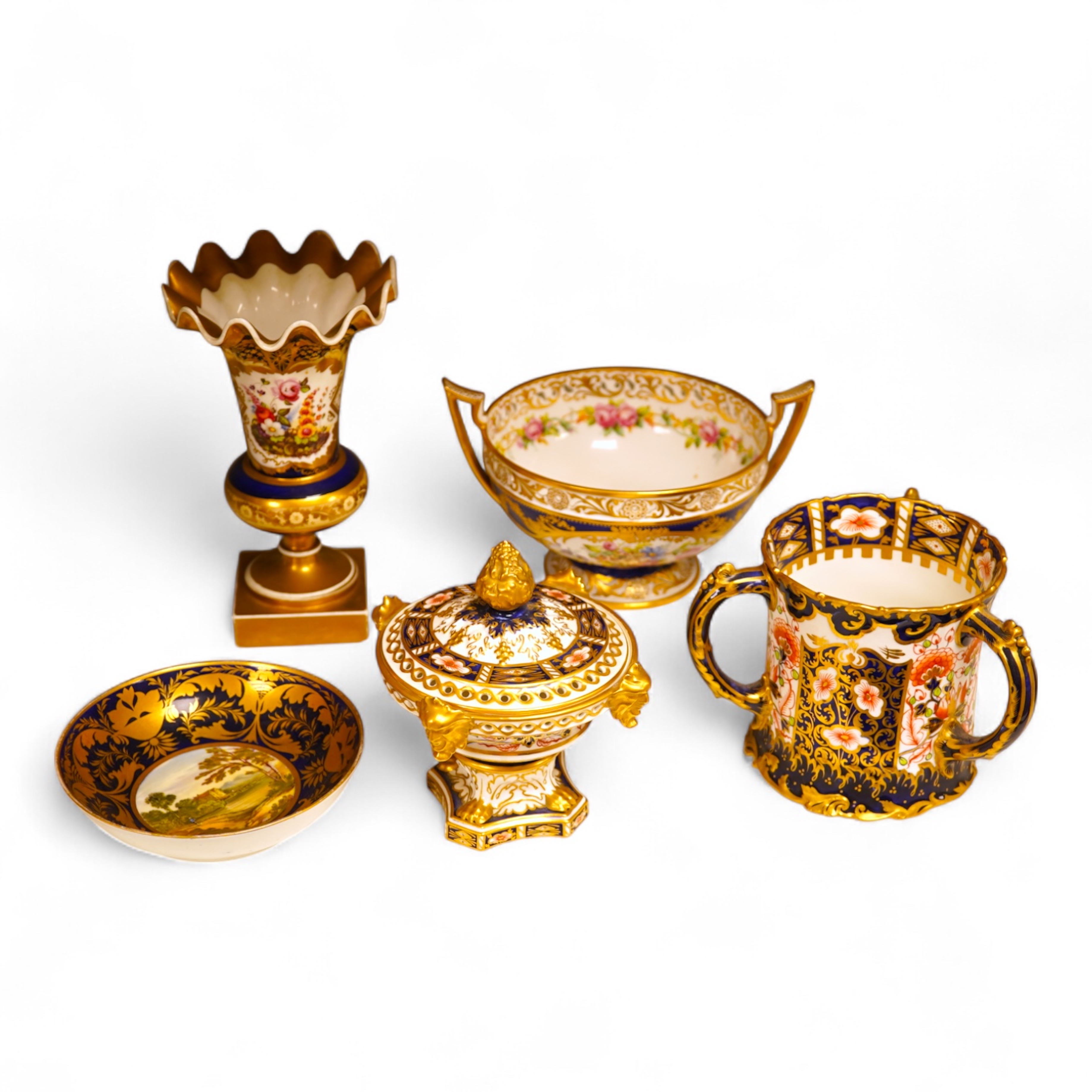 A collection of Royal Crown Derby, to include a two handled bowl, a fluted pedestal vase, saucer with landscape central cartouche etc (5). Vase 19cm high.
